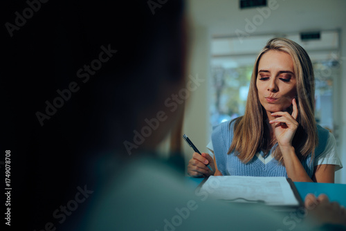 Skeptical Woman Signing a Contract Feeling Unsure. Person offering a signature on a document without reading it properly