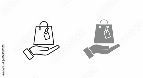 Hand holding a shopping bag with a price tag