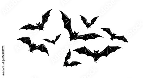 Set of black bat silhouettes flying in a group, a classic horror and Halloween symbol isolated on white