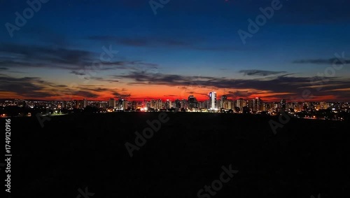 Wallpaper Mural A scenic panorama displays a cityscape during sunset, with vivid orange and blue hues Torontodigital.ca