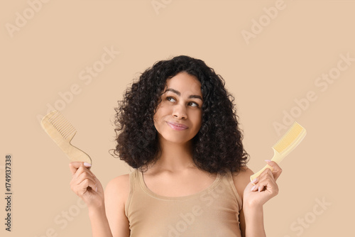 Young woman comparing hair ...