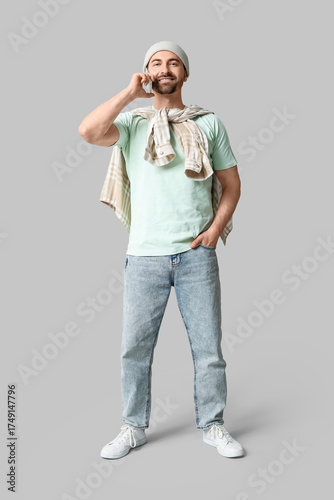 Young man with modern mobil...