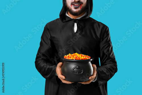 Young man dressed as vampir...