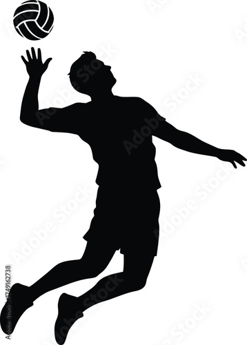 Silhouette of a volleyball player spiking the ball during a game