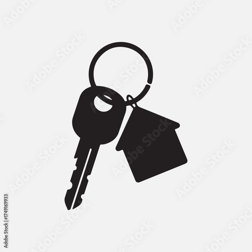 silhouette of a single house key on a ring with a small home shape keychain fob vector illustration.