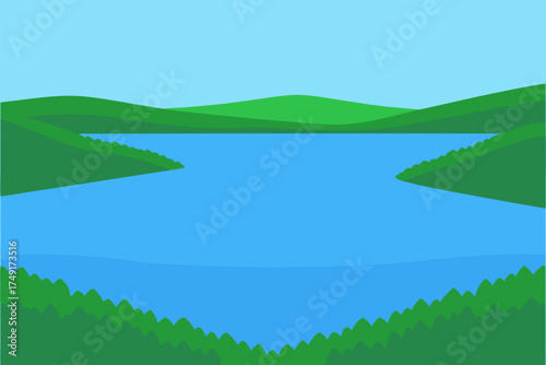 Serene blue lake surrounded by rolling green hills and trees