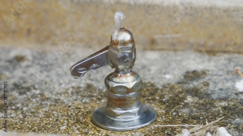 Close-up of a Park Faucet with Water Droplets