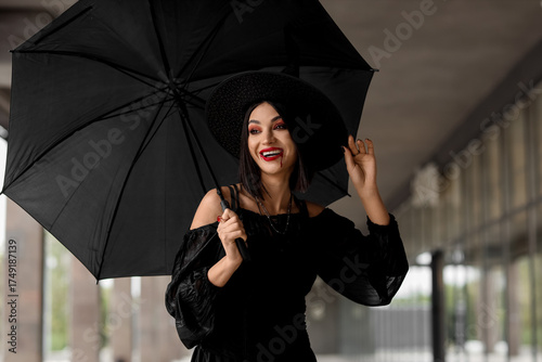 Smiling woman in witch cost...