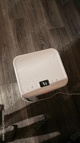 A device for dehumidifying an apartment from humidity and dampness. View from above. High critical humidity levels in the apartment are shown during the fall and spring.