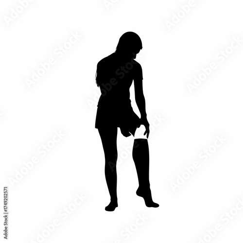 Physiotherapist silhouette wrapping injured knee with bandage isolated on white background