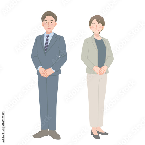 スーツを着た男女の立ち姿