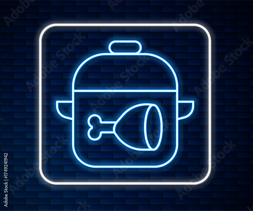 Glowing neon line Cooking pot and chicken leg icon isolated on brick wall background. Chicken drumstick. Vector