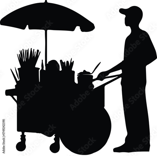 A silhouetted street vendor operates his food cart, shielded by an umbrella, in a quiet alley setting.