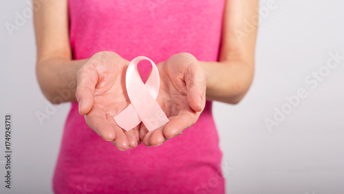 Wallpaper Mural Caucasian female middle aged model shows breast cancer awareness pink ribbon Torontodigital.ca