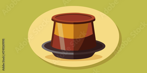 Reusable coffee pod in brown and black colors on a green background  
