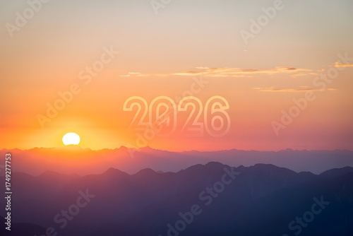 Sunset over mountains with 2026 text in sky