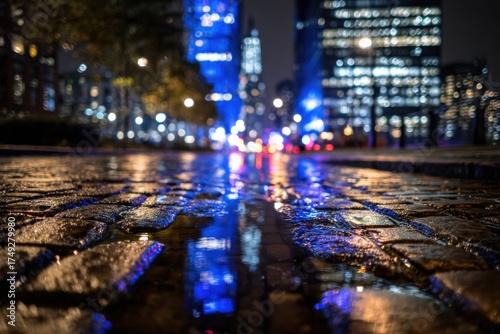 Wallpaper Mural Nighttime cityscape with reflections in wet cobblestone. Buildings and streetlights glow Torontodigital.ca