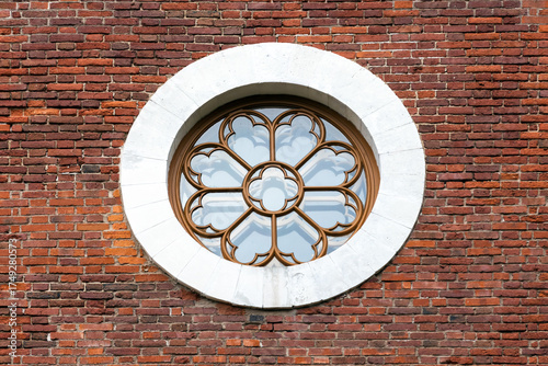 Wallpaper Mural A decorative circular window with intricate frame sits in a white stone circle Torontodigital.ca
