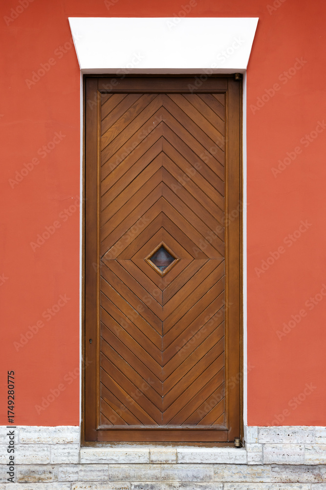 custom made wallpaper toronto digitalA tall wooden door featuring a chevron pattern sits within a vivid red wall