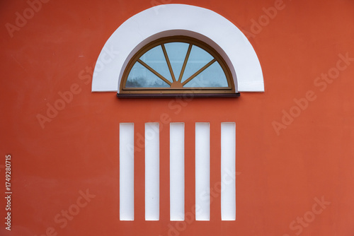 Wallpaper Mural Red building facade features a semicircle arched window set under white arch Torontodigital.ca
