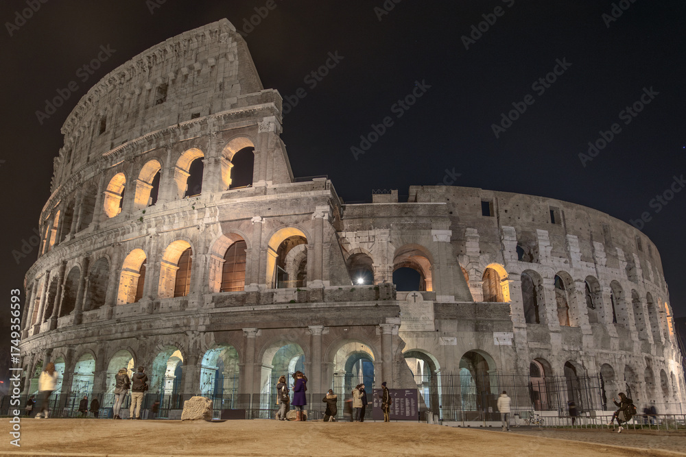 Naklejka premium The Colosseum Illuminated at Night in Rome, Italy