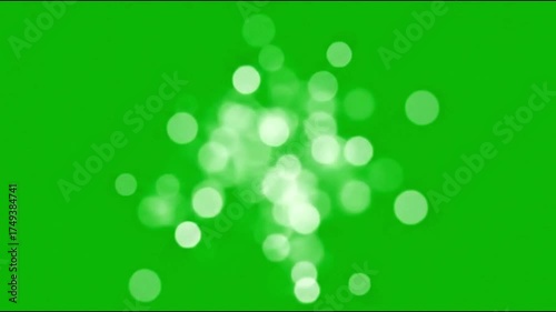 Soft white bokeh lights fading in and out, isolated on a green screen background.