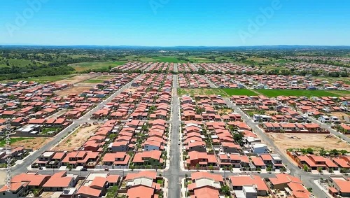 Wallpaper Mural An aerial view of a residential neighborhood, showing rows of homes, roads, and green landscape Torontodigital.ca