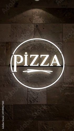 A lit circular sign displays the word 