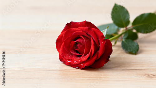 red rose on wooden background
