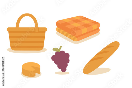 Summer picnic essentials including basket, blanket, grapes, cheese, and baguette