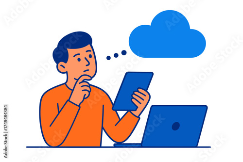 Man contemplating cloud computing while using a digital tablet near a laptop