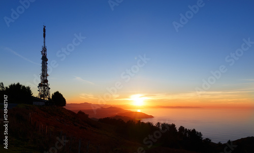 Communications tower. Antennas at sunset on Mount Jaizkibel, Basque Country