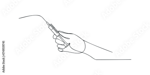 Hand holding syringe for medical injection