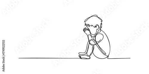 Child sits alone, head bowed, hands covering face