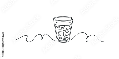 Glass of effervescent liquid with bubbles on abstract wavy line