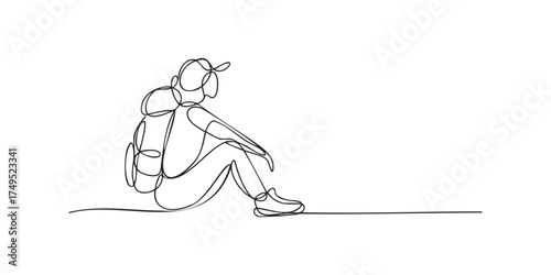 Person with backpack resting after journey