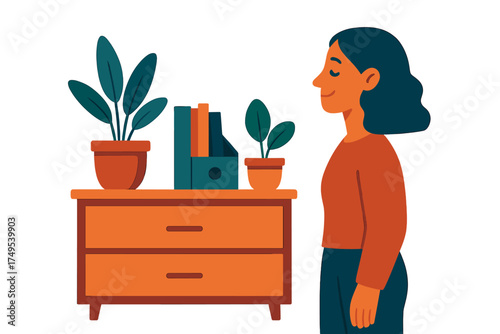 Content woman standing next to wooden storage cabinet with potted plants