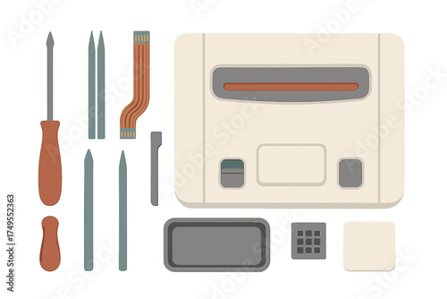 Disassembled vintage video game console parts and electronic repair tools on white background