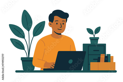 Smiling young professional working on a laptop at a tidy desk in a comfortable workspace