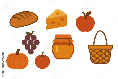 Autumn harvest collection of food items including bread cheese apple grapes pumpkin and honey