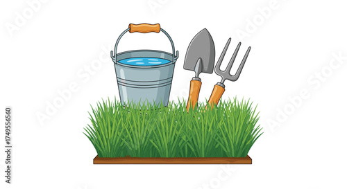 A collection of garden tools sits in the grass.