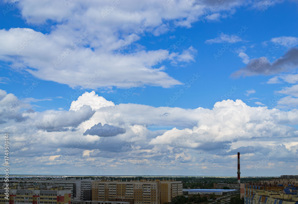 Fototapeta premium Panoramic cityscape with clouds and apartments