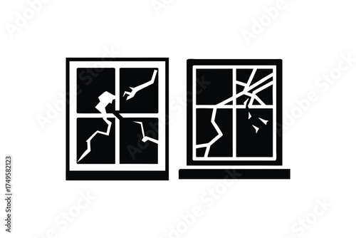 Two windows one intact and one broken displayed in stark silhouette