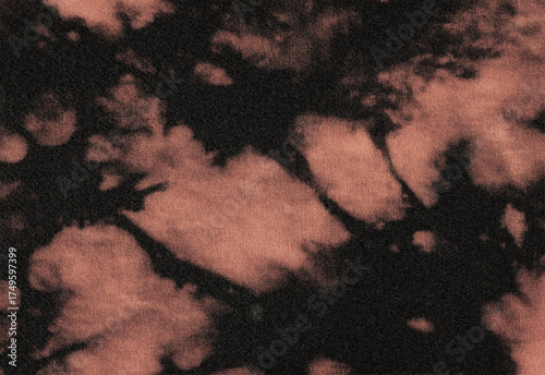 Close-up of a textured, abstract pattern with swirls of black and rust-colored hues, evoking a sense of organic movement and natural decay