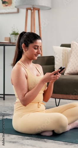 Phone, fitness and laughing with woman in home for online tips, workout app and social media. Progress tracking, digital exercise guide and reading with person in living room of house for wellness