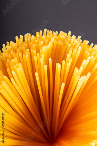 uncooked pasta standing upright, dry noodles, food concept