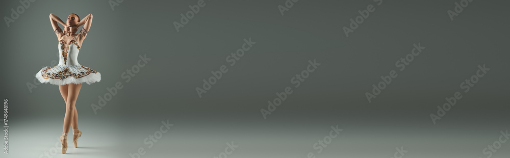 Fototapeta premium Captivating ballet dancer showcases grace and skill in a serene studio setting