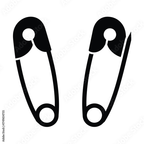 Two black safety pins sewing fasteners