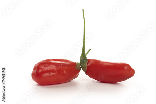 Fotografía Fresh Red Goji Berries Wolfberries with Green Stems on White Background