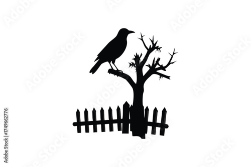 A solitary crow perched atop a bare tree branch with a fence